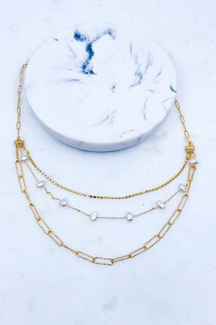 Three row multi chain pearl necklace